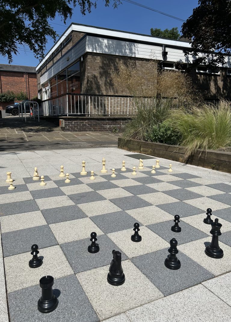Events 22 Chess pieces on the chess style paving in the library pocket park
